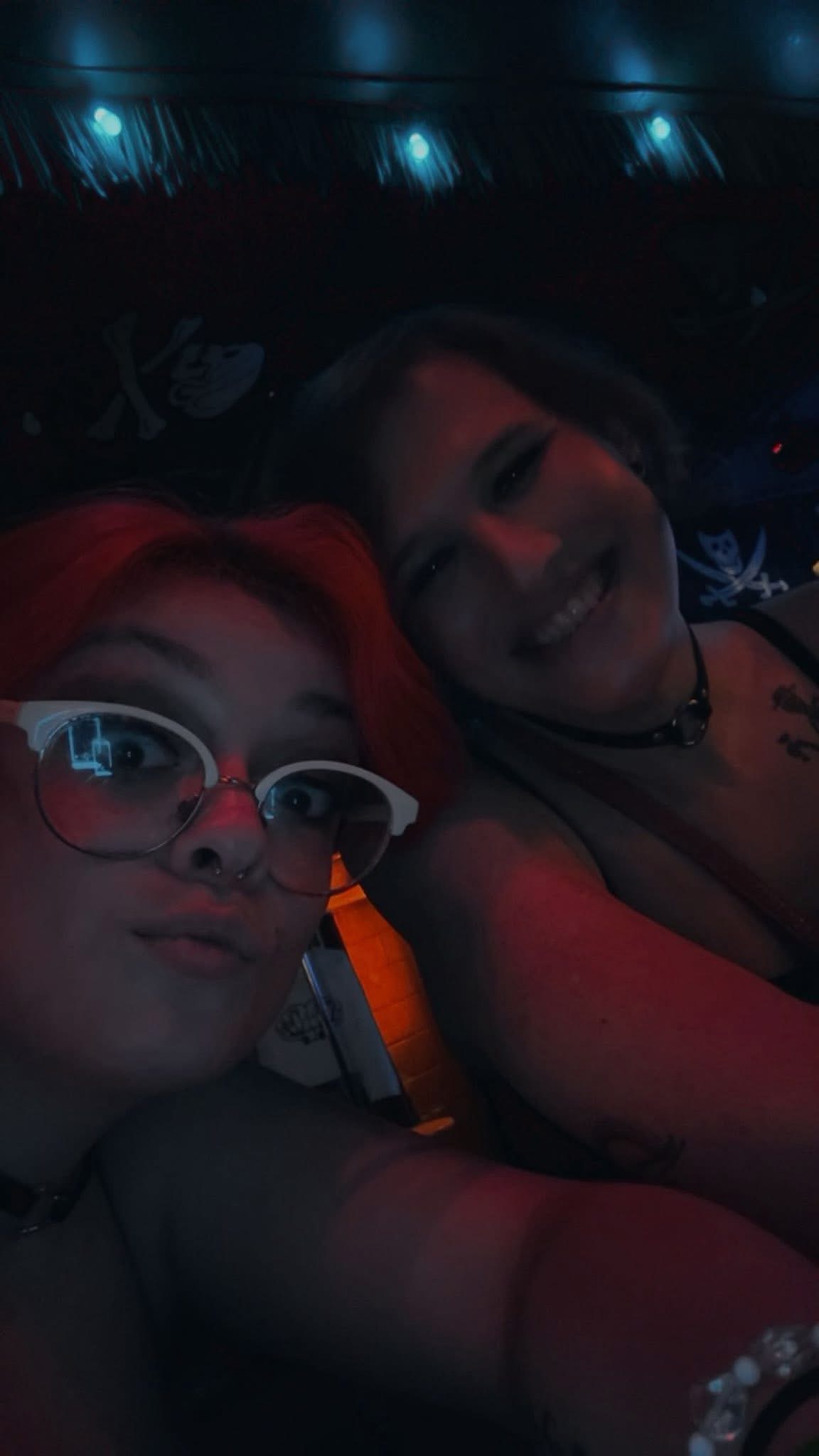 Two women smiling at bar